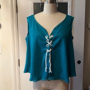 Turquoise knitted top with grommet/string closure